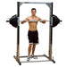 Body-Solid Powerline Smith Machine PSM144X - man next to it