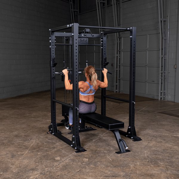 Body Solid Pro Club Line Flat Utility Bench - woman doing bench press