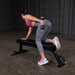 Body Solid Pro Club Line Flat Utility Bench - woman working out