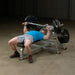 Body Solid Pro Club Line Leverage Bench Press - man using it 