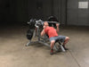 Body Solid Pro Club Line Leverage Incline Press - man using it 