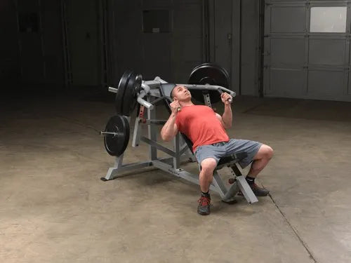 Body Solid Pro Club Line Leverage Incline Press - man using it 