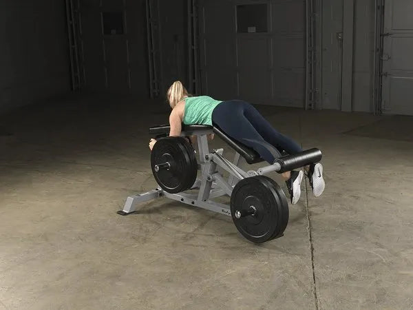Body Solid Pro Club Line Leverage Leg Curl - with barbels on it 