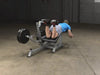 Body Solid Pro Club Line Leverage Leg Curl - man using it 