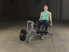 Body Solid Pro Club Line Leverage Leg Extension - woman doing leg press