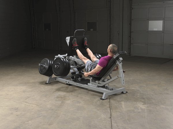 Body Solid Pro Club Line Leverage Leg Press - man exercising on it