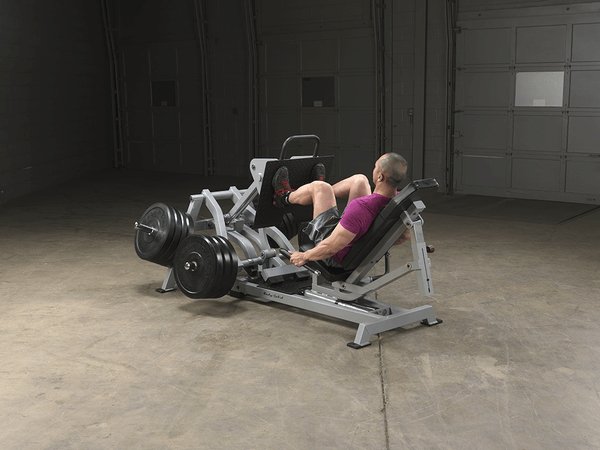 Body Solid Pro Club Line Leverage Leg Press - man using it 