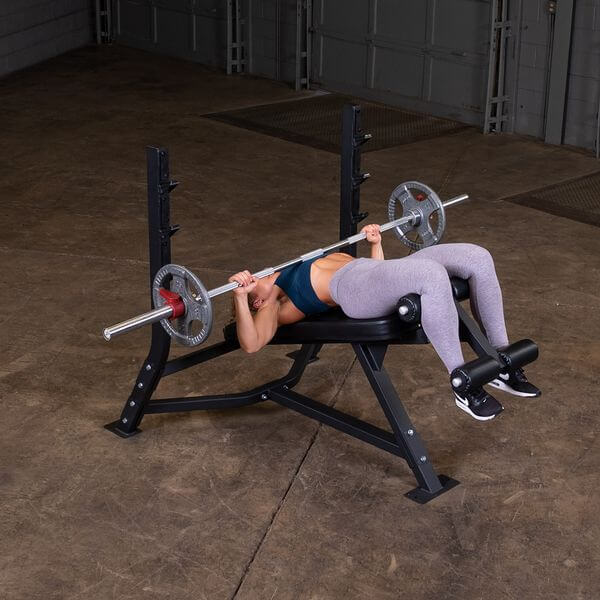 Body Solid Pro Club Line Oly Decline Bench - woamn doing bench press