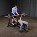 Body Solid Pro Club Line Oly Flat Bench - woman working out 