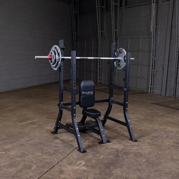 Body Solid Pro Club Line Oly Shouder Press Bench - with barbel on it 