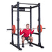 Body Solid Pro Club Line Power Rack Base Rack SPR1000 and Extension - man lifting weights