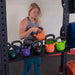 Body Solid Pro Club Line Power Rack Double Rack/Extension w Monkey Bar - woman holding several kettleballs