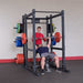 Body Solid Pro Club Line Power Rack Double SPR1000 w. Monkey Bar - men working out on it 