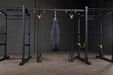 Body Solid Pro Club Line Power Rack, Half Rack Connecting Bar -different gym equipments attached to it 