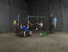 Body Solid Pro Club Line Power Rack, Half Rack Connecting Bar - group of people working out