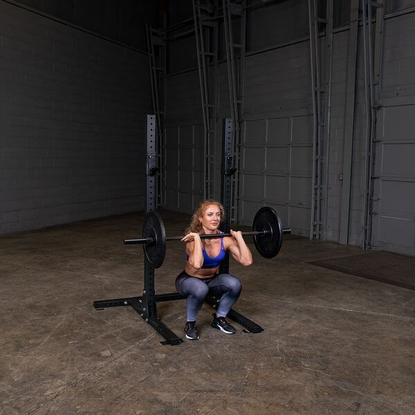 Body Solid Pro Club Line Squat Stand - woman doing squats 