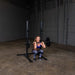 Body Solid Pro Club Line Squat Stand - woman doing squats 
