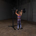 Body Solid Pro Club Line Squat Stand - woman lifting a black barbel