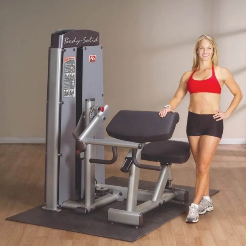 Body-Solid Pro Dual Commercial Bicep/Tricep Machine DBTC-SF - smiling woman while holding the machine
