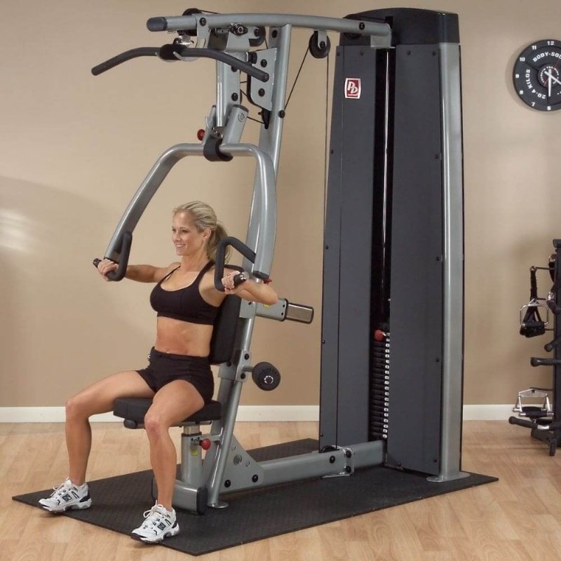 Body-Solid Pro Dual Commercial Vertical Press and Lat Station DPLS-SF - woman using the machine