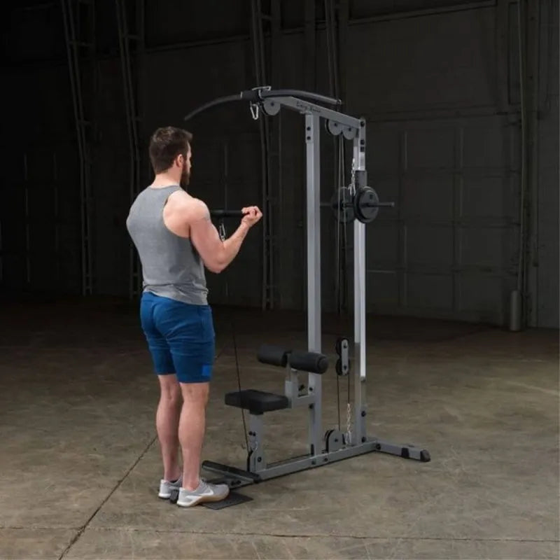 Body-Solid Pro Lat Pulldown Low Row Machine GLM83 - Man working on low pulleys
