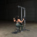 Body-Solid Pro Lat Pulldown Low Row Machine GLM83  - woman on lat down exercise