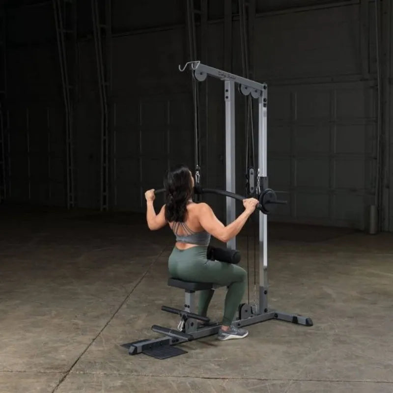 Body-Solid Pro Lat Pulldown Low Row Machine GLM83  - woman on lat down exercise