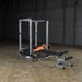 Body-Solid Pro Power Rack GPR378 - woman fully using the rack for assistance with barbell