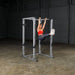 Body-Solid Pro Power Rack GPR378 - Woman on leg raise while using the rack