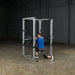 Body-Solid Pro Power Rack GPR378 - Man kneeling down while holding barbell