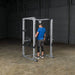 Body-Solid Pro Power Rack GPR378 - man standing on the product holding barbell