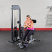  Body-Solid Pro Select Ab And Back Machine GCAB-STK - Woman doing workouts crossed arm and using the cushioned rollers