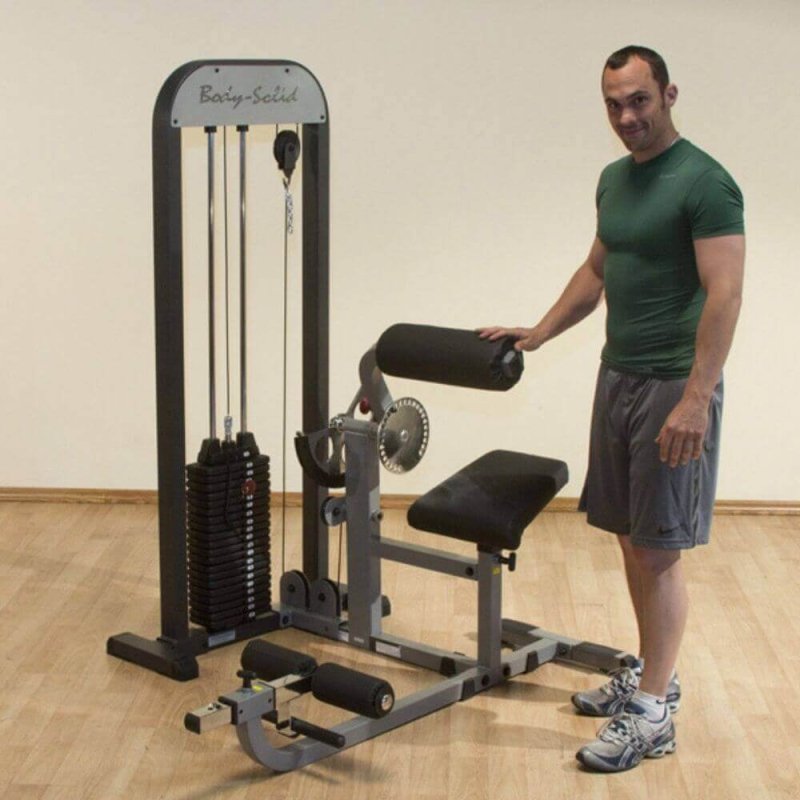 Body-Solid Pro Select Ab And Back Machine GCAB-STK man standing beside the product