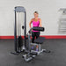 Body-Solid Pro Select Ab And Back Machine GCAB-STK - Woman standing behind the product