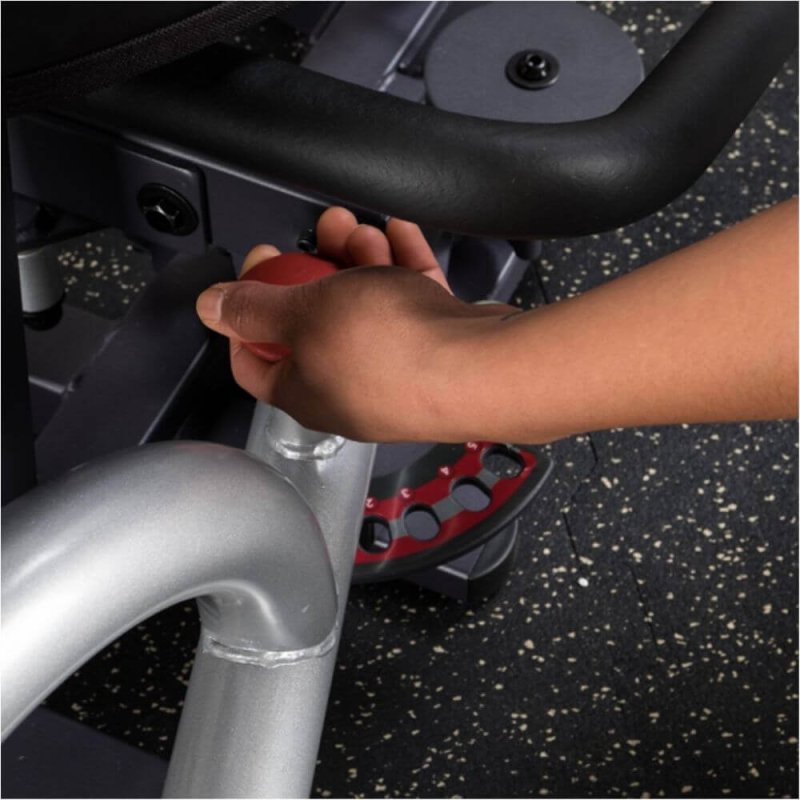 Body-Solid Pro-Select Inner/Outer Thigh Machine GIOT-STK - woman holding adjustments