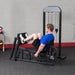 Body-Solid Pro-Select Leg And Calf Press Machine GLP-STK - Man legs curl up for leg press workout
