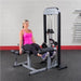 Body-Solid Pro Select Leg Extension Leg Curl Station GCEC-STK - woman showing her leg extension exercise