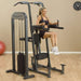 Body-Solid Pro Select Weight Assisted Chin-Dip Machine FCD-STK - Woman doing knee raise exercise