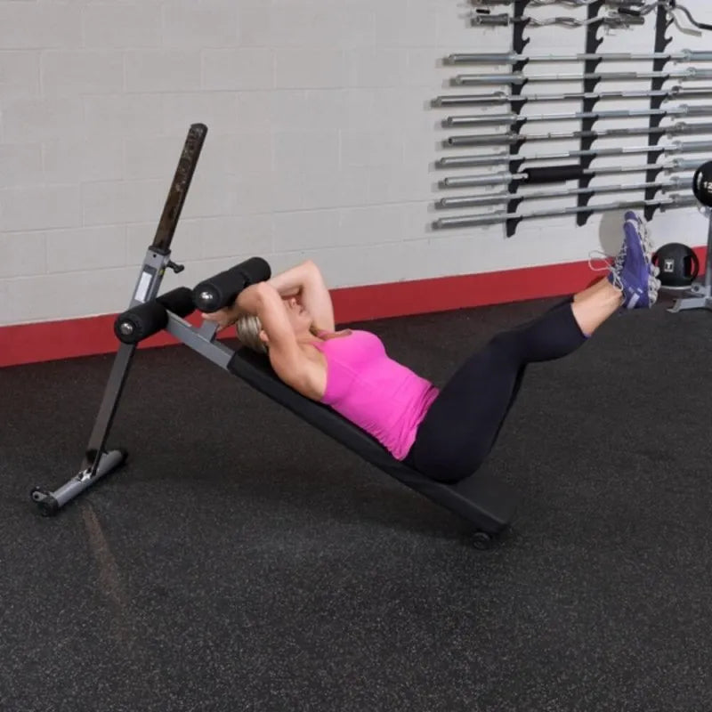 Body-Solid Pro-Style Ab Board GAB60 - Woman on bench curl up