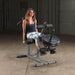 Body-Solid Seated Leg Extension & Supine Curl GLCE365 - Woman in training leg extension