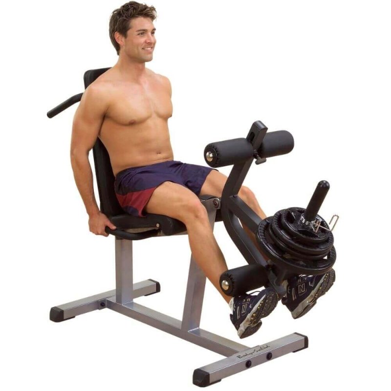 Body-Solid Seated Leg Extension & Supine Curl GLCE365 - Man on straight sitting position with leg extension post