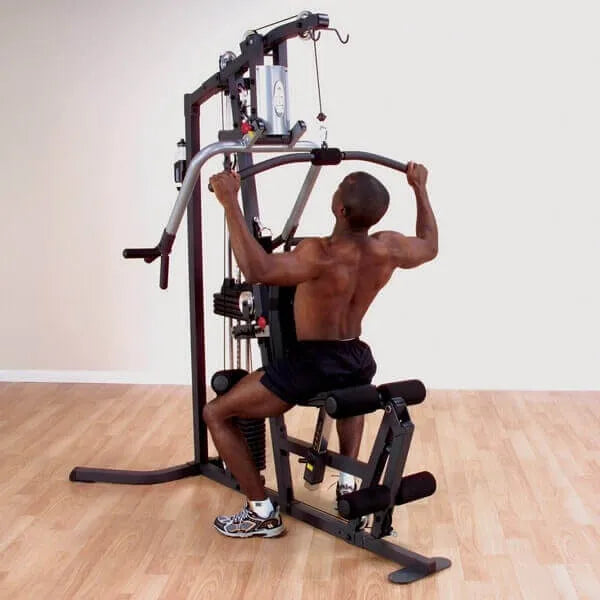 Body-Solid Selectorized Single Stack Home Gym G3S - Man sitting on bench doing arm workout