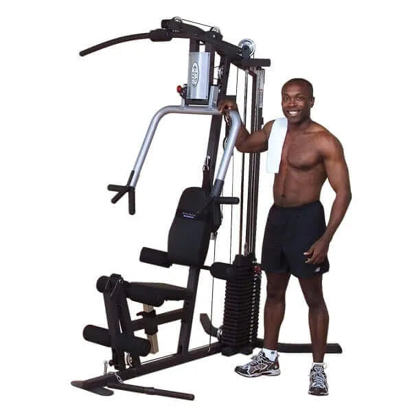 Body-Solid Selectorized Single Stack Home Gym G3S - a man standing next to a gym machine