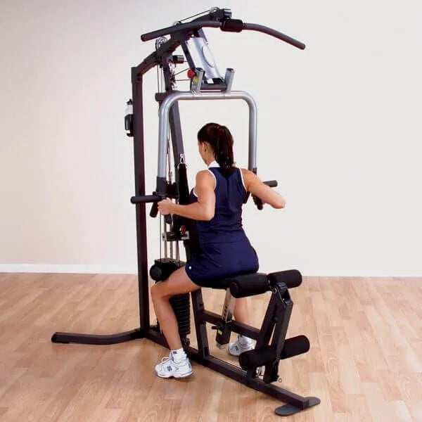 Body-Solid Selectorized Single Stack Home Gym G3S - a woman working out while sitting on bench