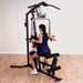 Body-Solid Selectorized Single Stack Home Gym G3S - a woman working out while sitting on bench
