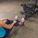 Body-Solid Single Stack Gym G5S - Half body view woman sitting on the floor while pulling weights