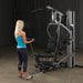 Body-Solid Single Stack Gym G5S - Woman standing up pulling weights