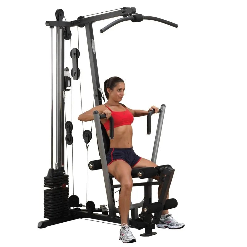 Body-Solid Single Stack Home Gym G1S - Woman sitting on bench doing arm workout