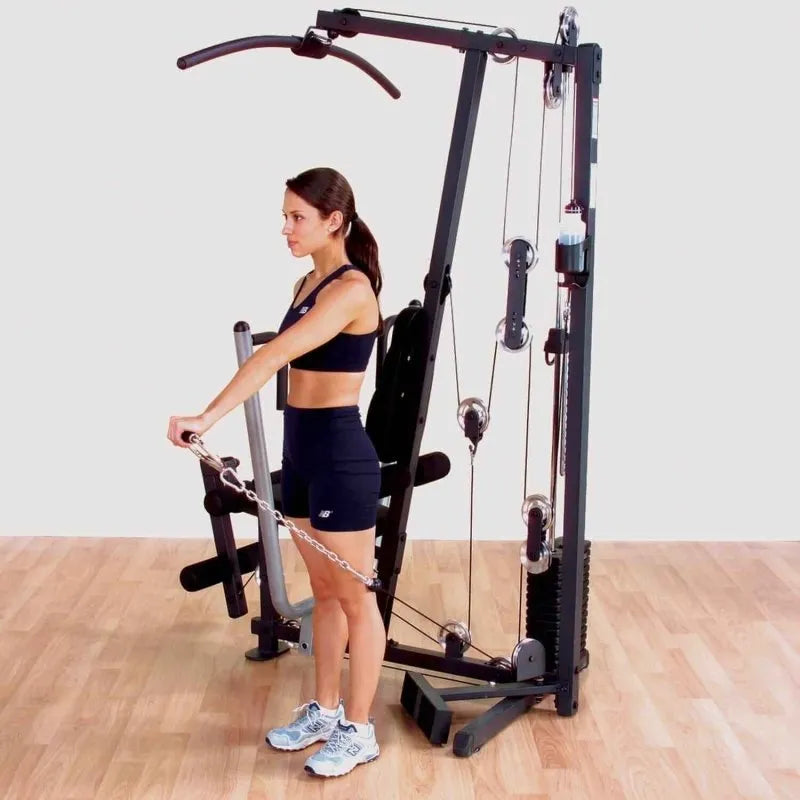 Body-Solid Single Stack Home Gym G1S - Woman pulling weights with her left arm while standing up