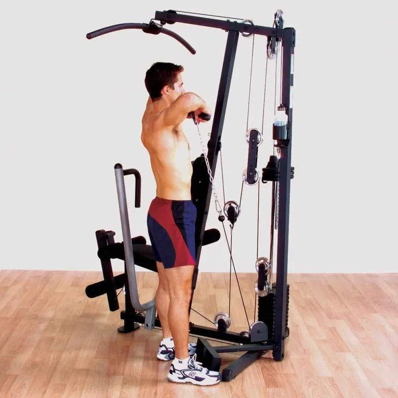 Body-Solid Single Stack Home Gym G1S - Man pulling weights with hands while standing up